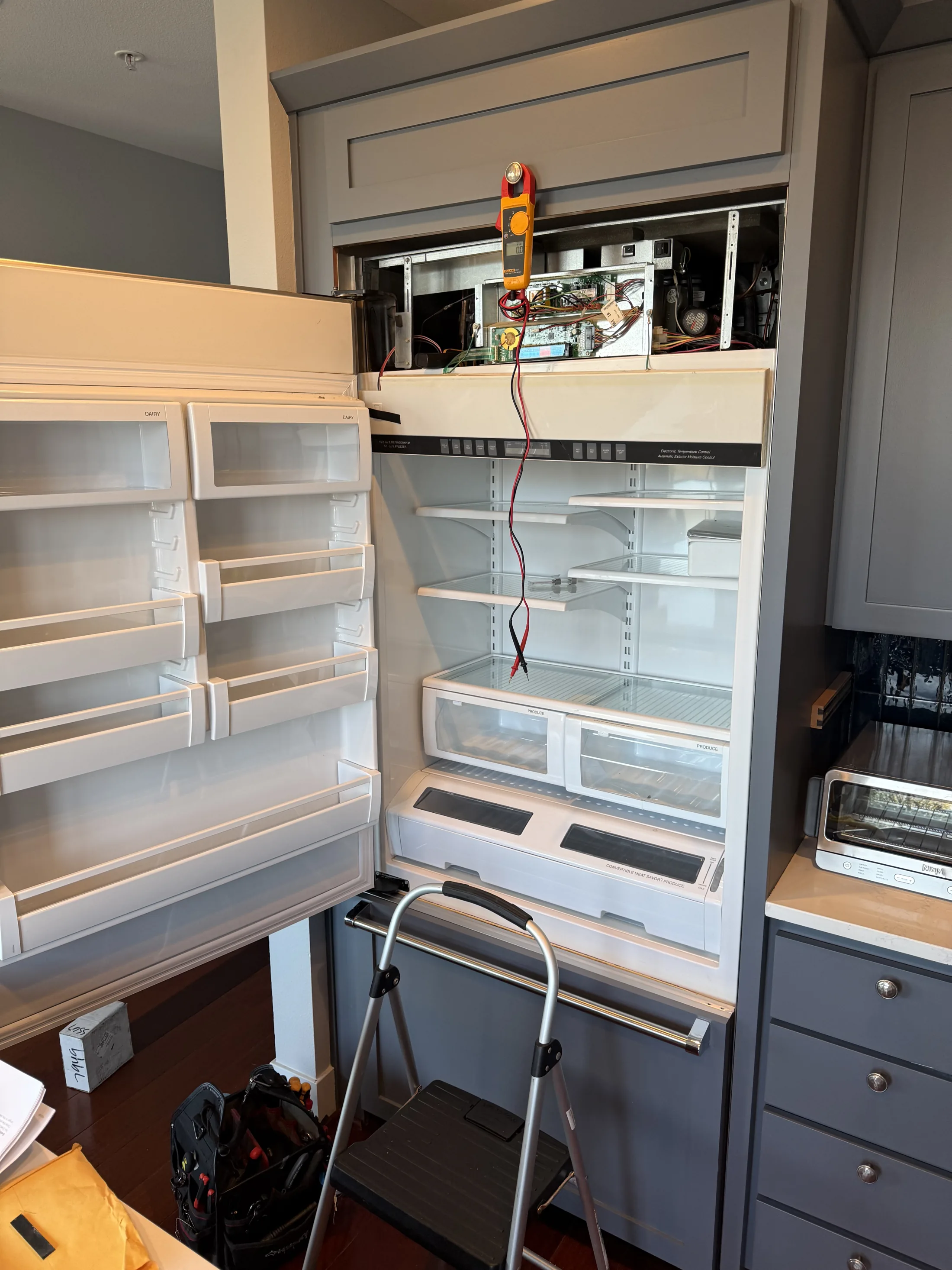 Built-in refrigerator column opened for electrical diagnostics