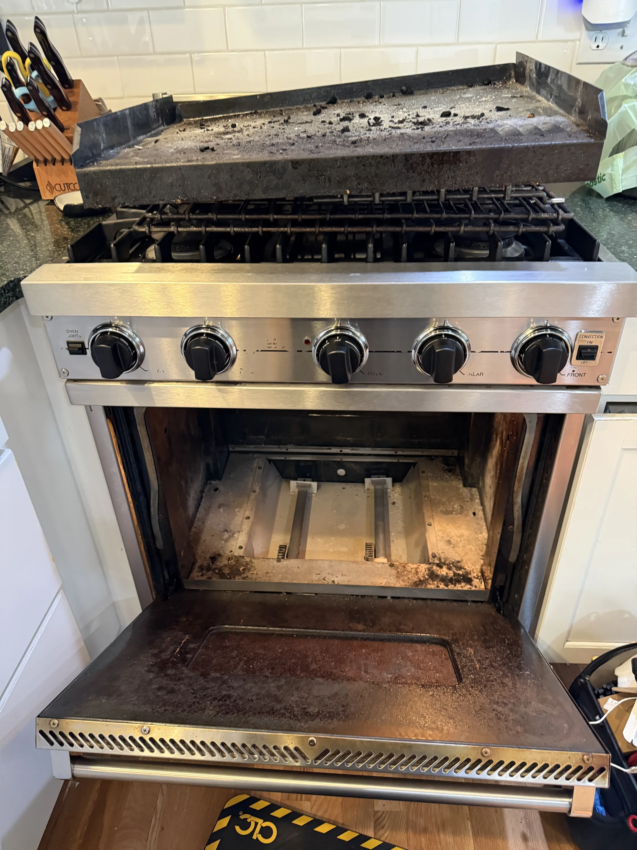 Range grates and griddle removed during diagnostics